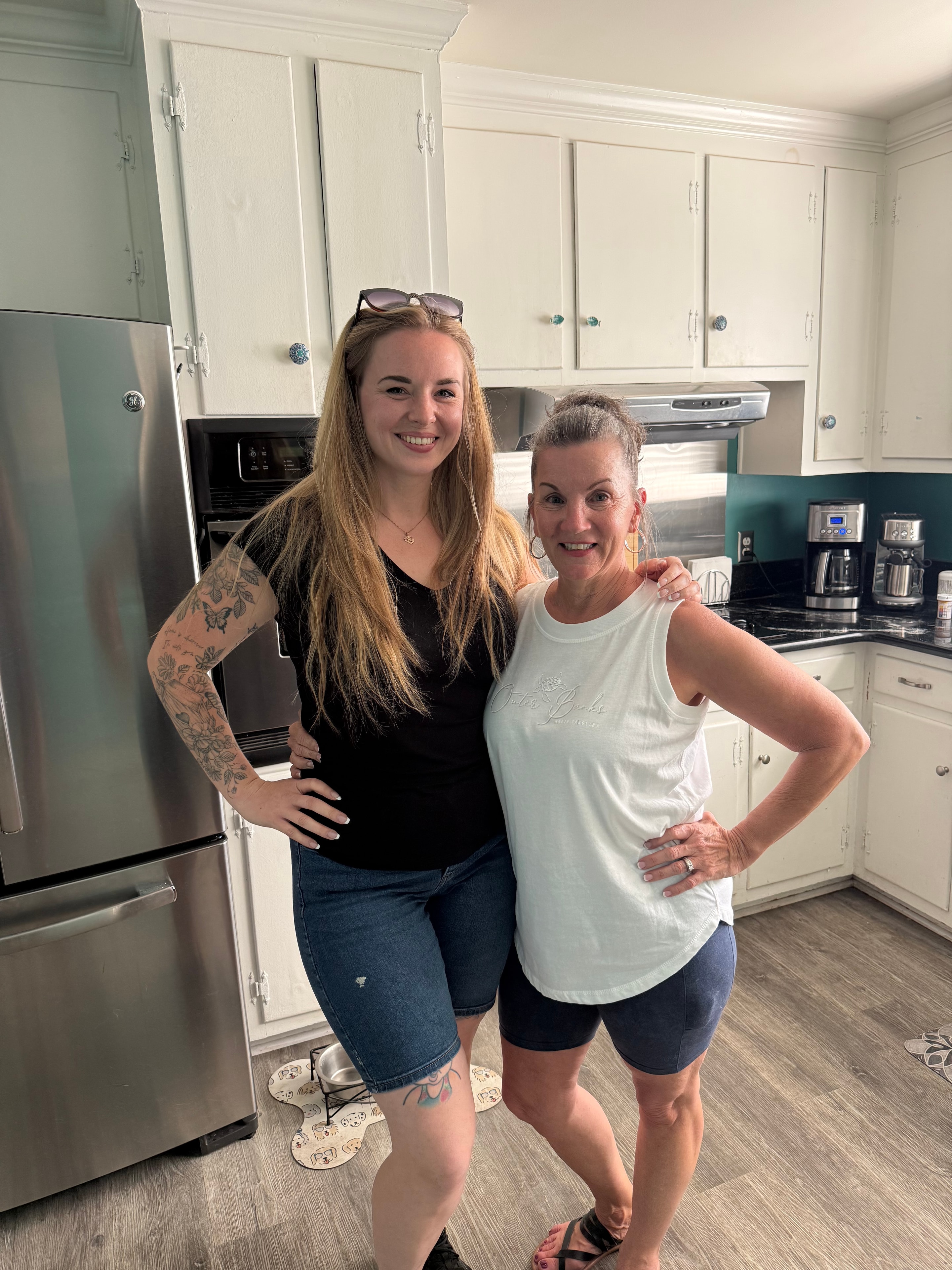 Tara with clients in their new kitchen